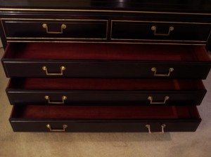 This CHEST was real rosewood, and I painted it.  The drawers inside were rosewood not red.  The outside was painted red first and black and then distressed.